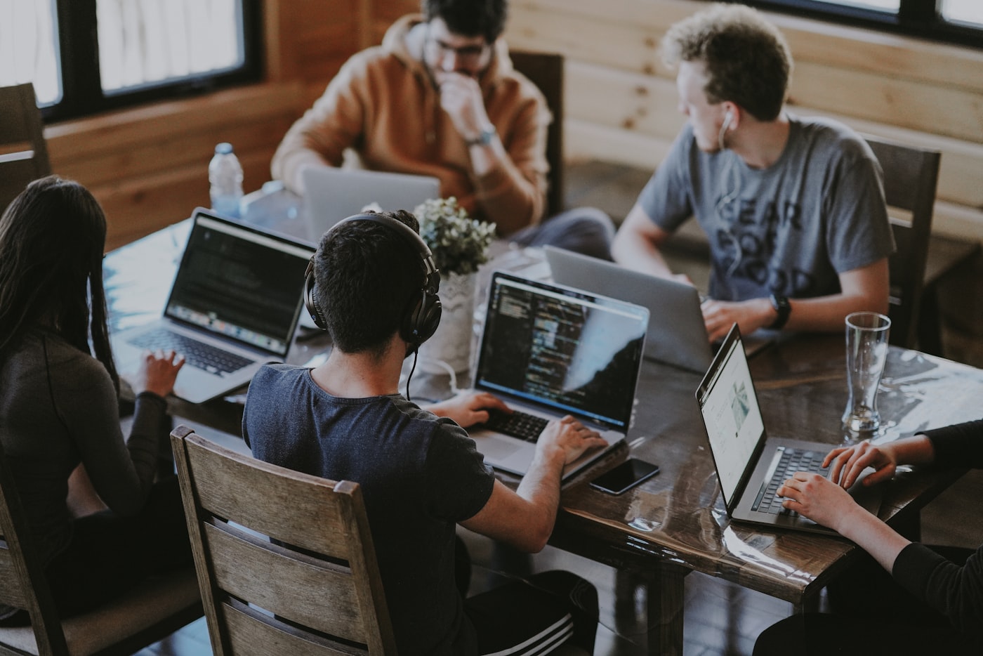 A distributed team working together on laptops